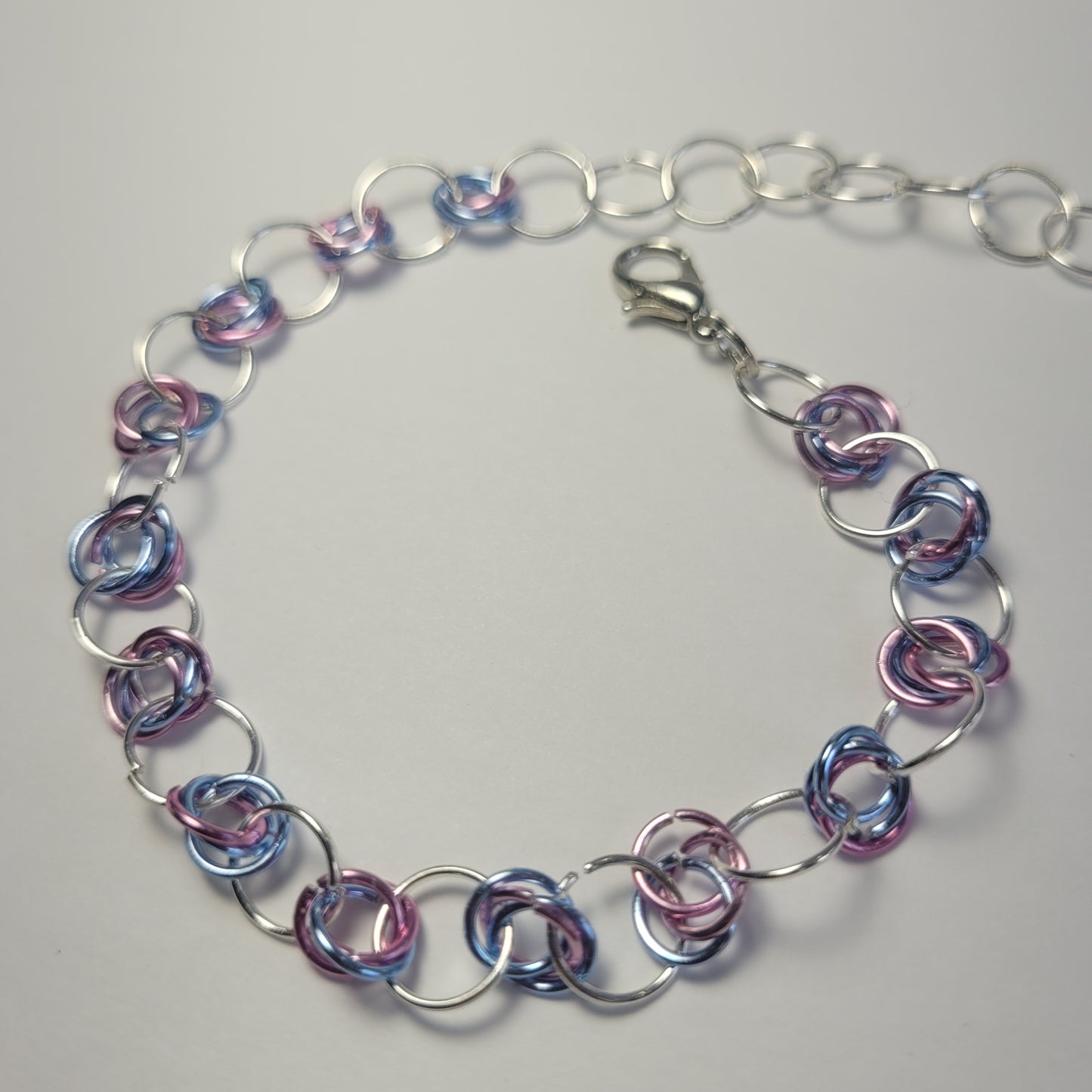 Bracelet and earring set, light pink, blue and silver chainmail