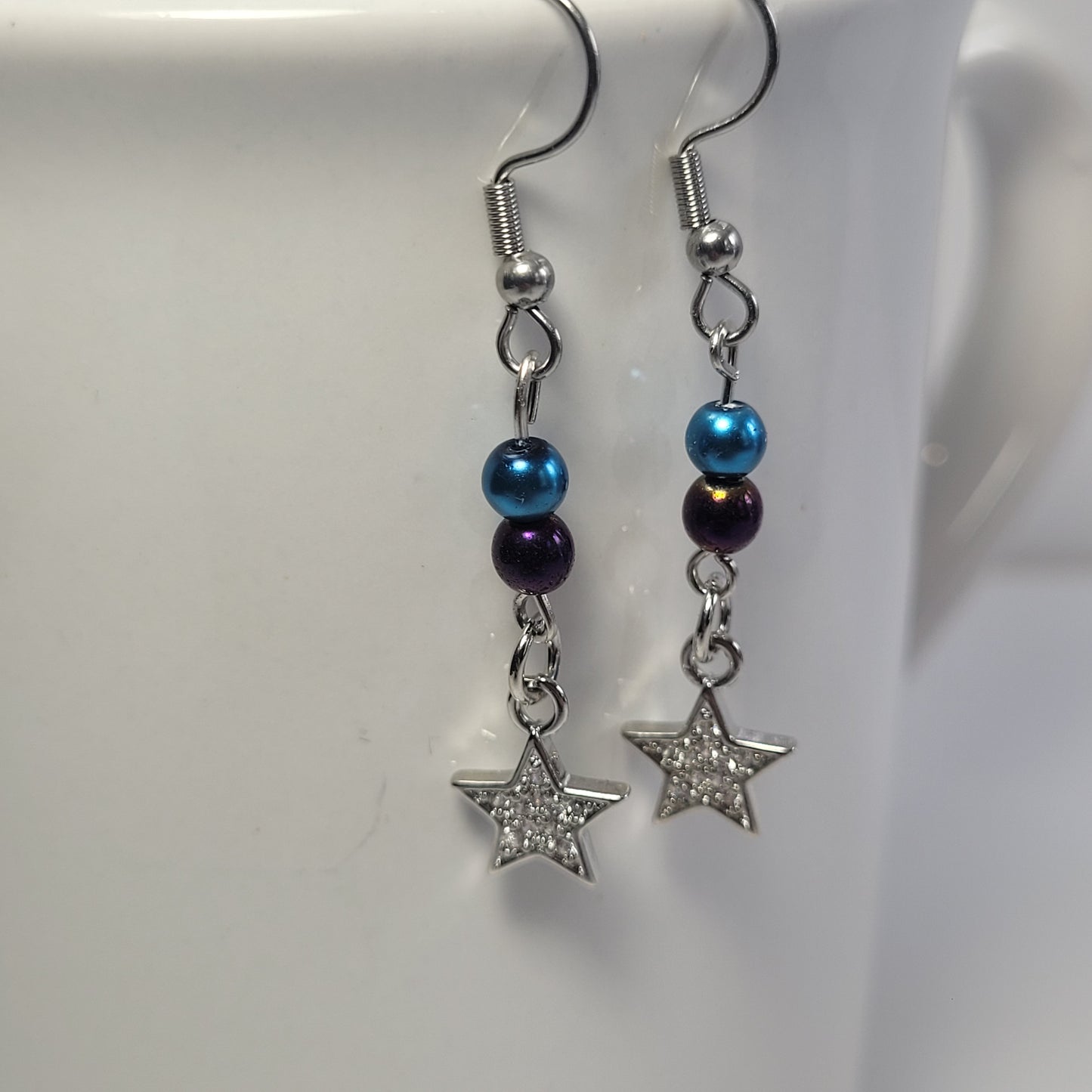 Earrings, blue and purple bead with dangle diamond star